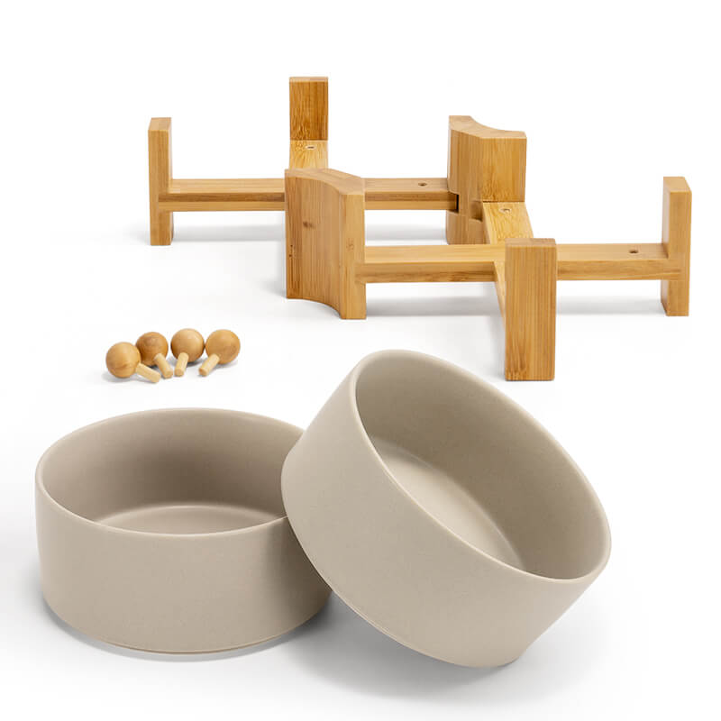 2 grey dog bowls and the bamboo stand with bamboo balls that can pad up the bowl