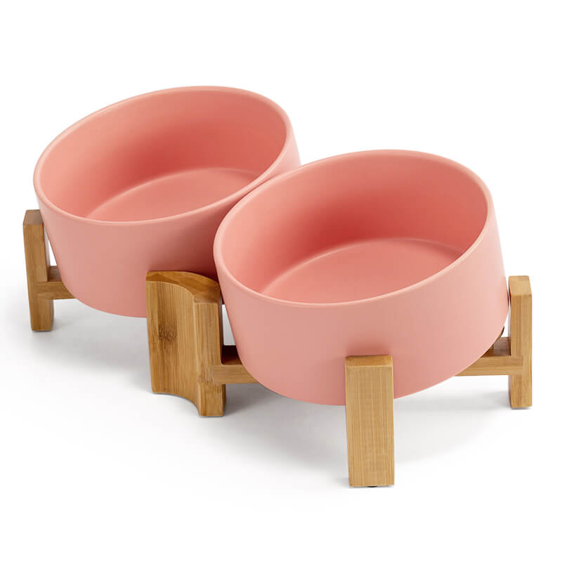 a set of pink 15° tilted pet bowls of the right side view