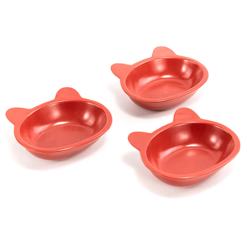 three neatly placed lovely red cat-shaped cat dishes