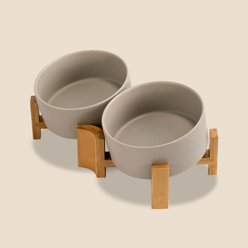 a set of grey 15° tilted pet bowls in grey background