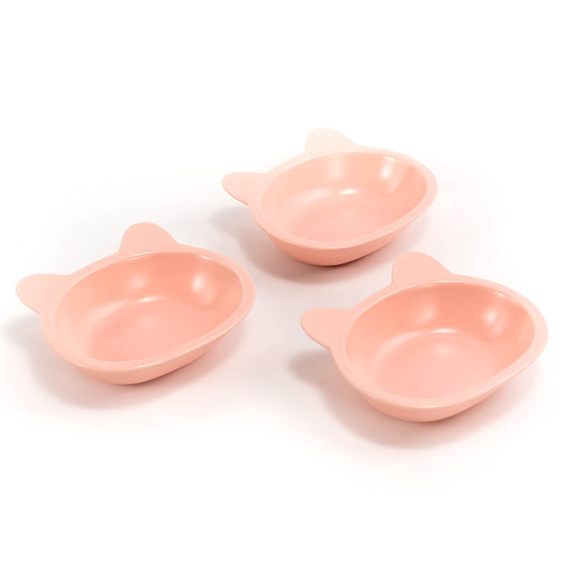 three neatly placed lovely pink cat-shaped cat dishes