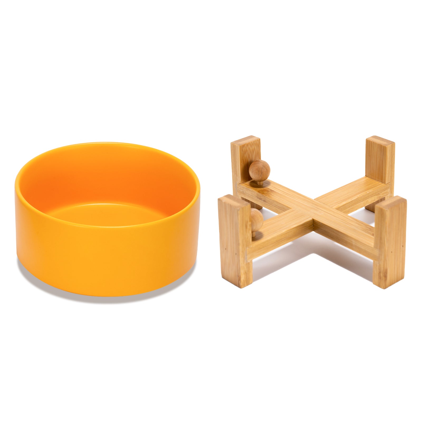 separate placed yellow ceramic dog bowl with its tilted bowl stand