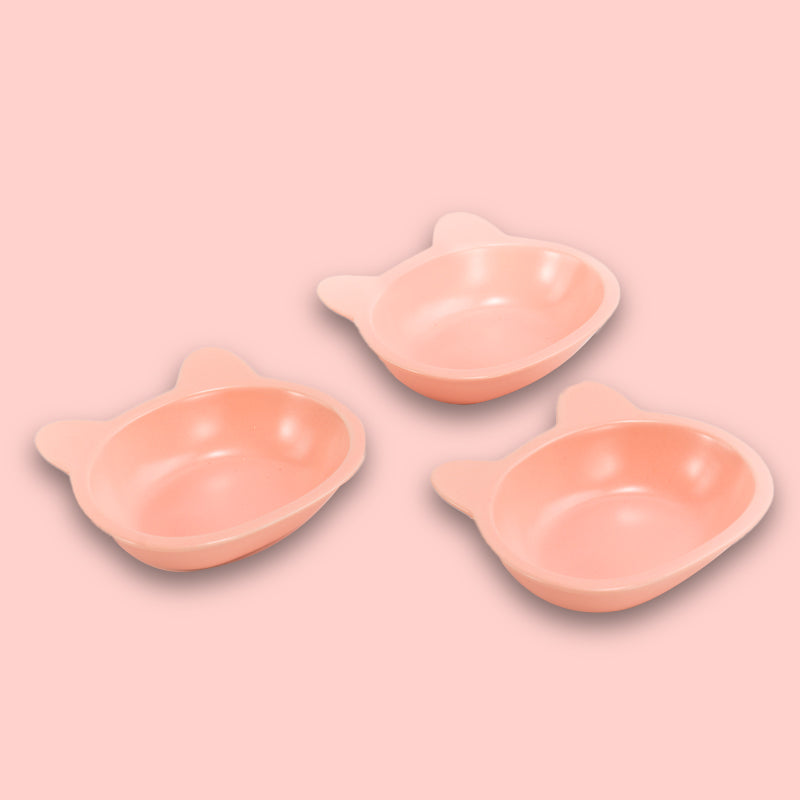three neatly placed lovely pink cat-shaped cat dishes in the pink background