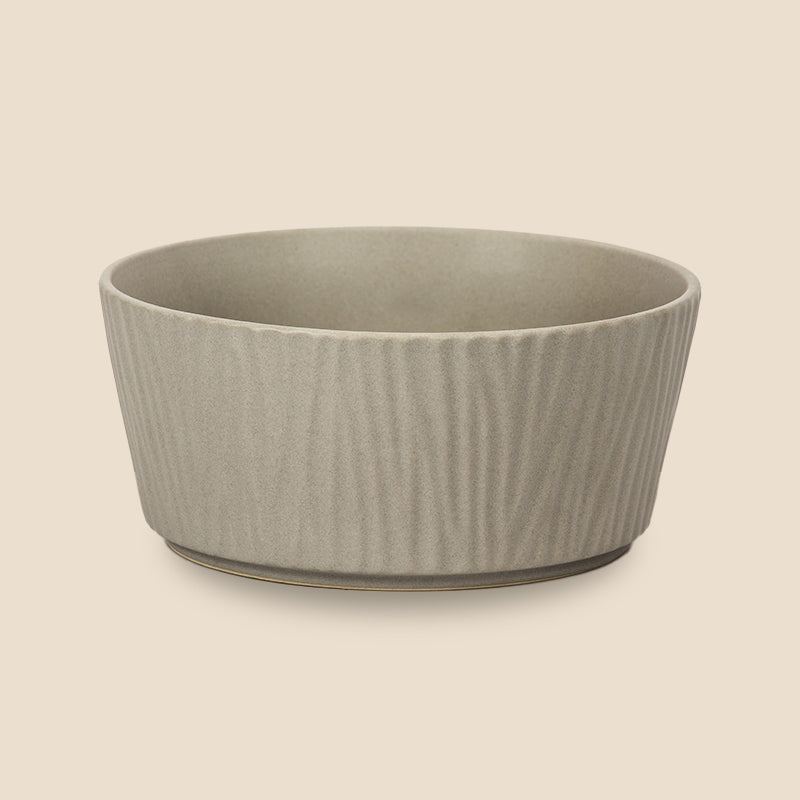 the front view of the bark-patterned large grey ceramic dog bowl in the grey background