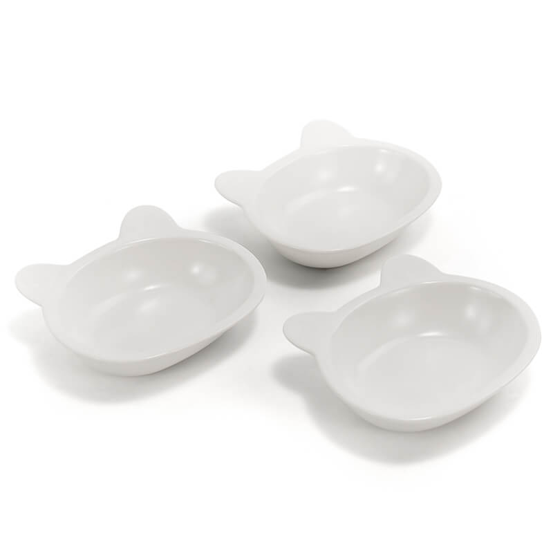 three neatly placed lovely white cat-shaped cat dishes