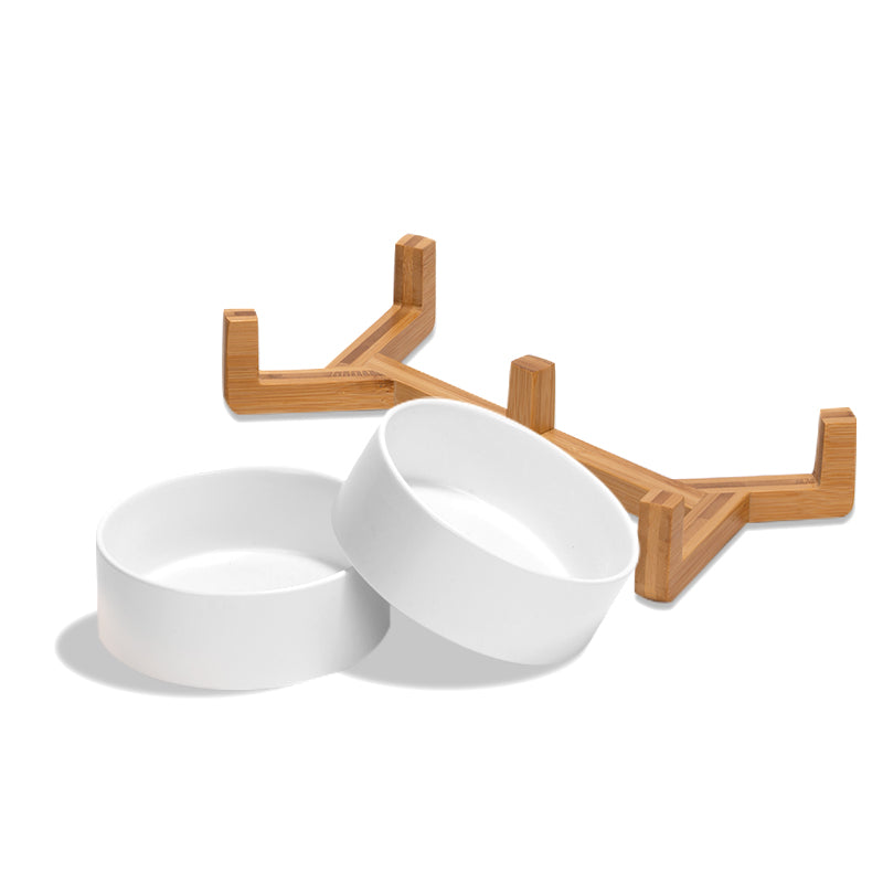 two cute white ceramic pet bowls and the stand