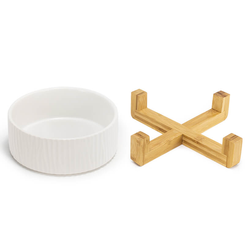 separately placed white dog bowl with bark pattern and its bamboo stand