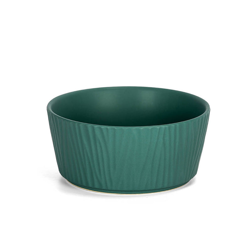 the front view of the large green ceramic dog bowl with bark pattern