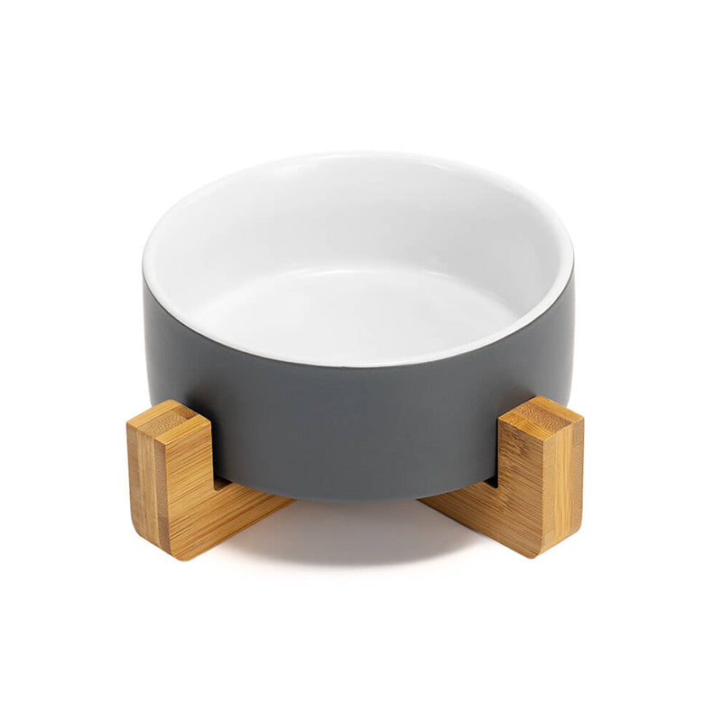 front view of the ceramic dog bowl with gray exterior and white interior colors on the stand
